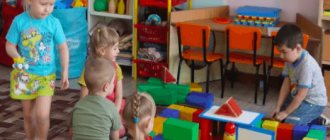 Preschoolers play with building a large construction set from parts